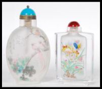Two 20th Century Chinese glass perfume bottles one of ovoid form with frosted glass body, bird of