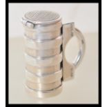 A stamped 925 silver vesta case in the form of a tankard having a hinge lid with striker. Weight