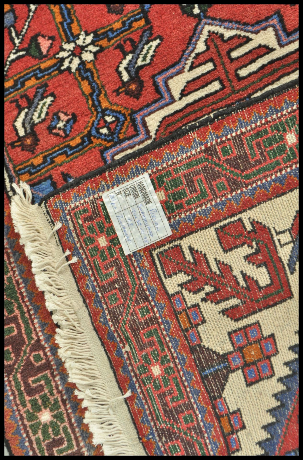 A 20th Century Persian carpet floor rug having a red ground with central tree of life panel and - Bild 4 aus 4