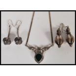 A group of silver jewellery to include a silver box link necklace with marcasite and green stone