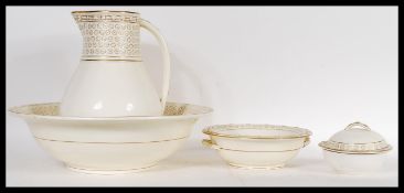 An early 19th Century Wedgwood ceramic bathroom set in an ivory blush palette consisting of wash