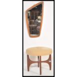 A retro 20th century teak wood circular G-Plan dressing table stool raised on teak wood x-cross base