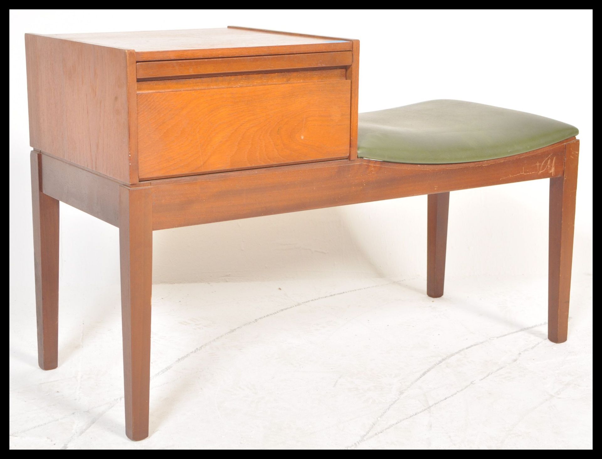 A retro 1970's teak wood telephone table / seat by Mr Chippy, button back seat pad with drawer above