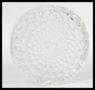 A vintage retro 20th Century moulded clear glass vase of disc form having concentric circular