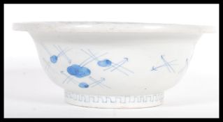 A late 18th / early 19th Century Chinese blue and white porcelain bowl having hand painted