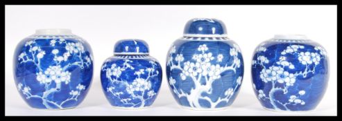A Group of four Chinese 19th Century hand painted blue and white ginger jars in the prunus