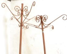 A large pair of early 20th Century copper floor standing garden weathered hanging planter stands