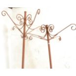 A large pair of early 20th Century copper floor standing garden weathered hanging planter stands