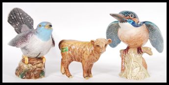 A collection of Beswick ceramics to include a Kingfisher figurine no. 2371, a Cuckoo bird no. 2315m,