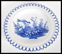 A 19th Century transfer printed blue and white pearlware ribbon plate having a central cartouche