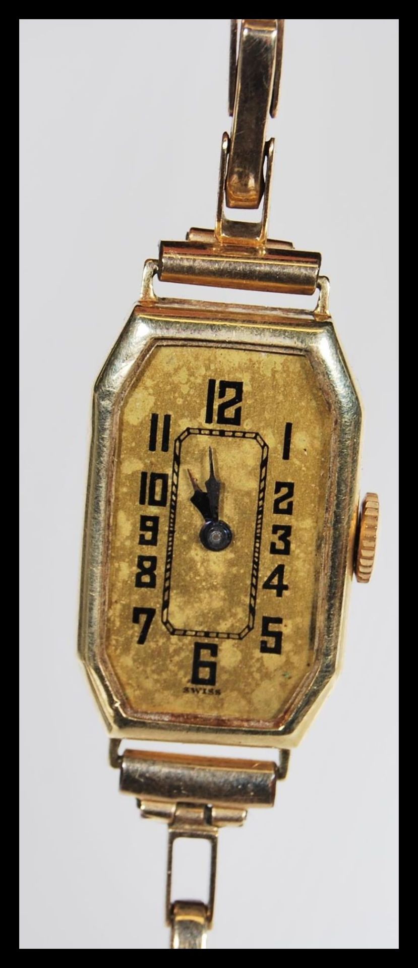 A stamped 9ct gold early 20th Century Art Deco cocktail watch having a rectangular face with a