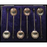 A set of six early 20th Century hallmarked silver coffee or tea spoons having octagonal scalloped