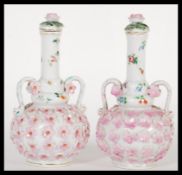A pair of 19th Century continental porcelain German bottle vases complete with covers or lids. The