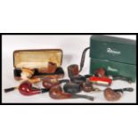 A good collection of vintage smoking tobacco pipes to include two boxed Peterson pipes, cased