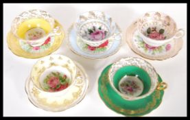 A collection of five Foley Bone China cabinet tea cups and saucers, each decorated in different