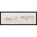Two 9ct white gold rings to include a wishbone ring set with white accent stones (hallmarked London,