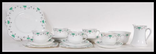An early 20th Century Art Deco 1930's tea service having a white ground with a green and black