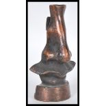 A vintage 20th Century bronze / bronzed metal glasses holder in the form of a nose in the manner