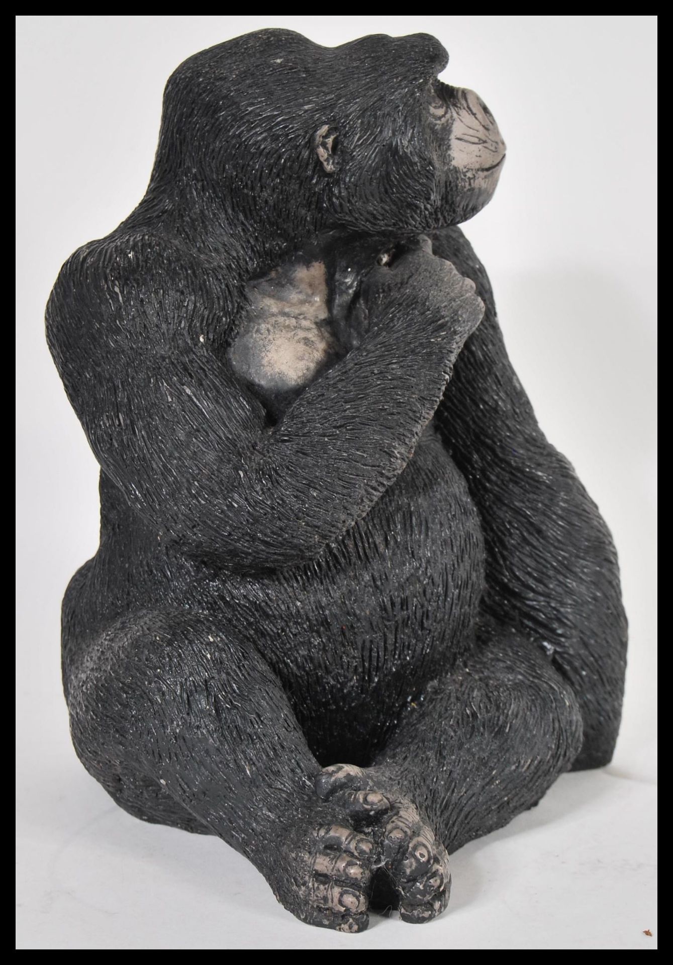 A 20th Century resin figurine in the form of a sitting gorilla, bearing the makers mark Carn to - Bild 2 aus 4