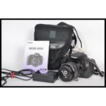 A Canon EOS 600D digital camera in working order, with carry case, charger, power lead, spare