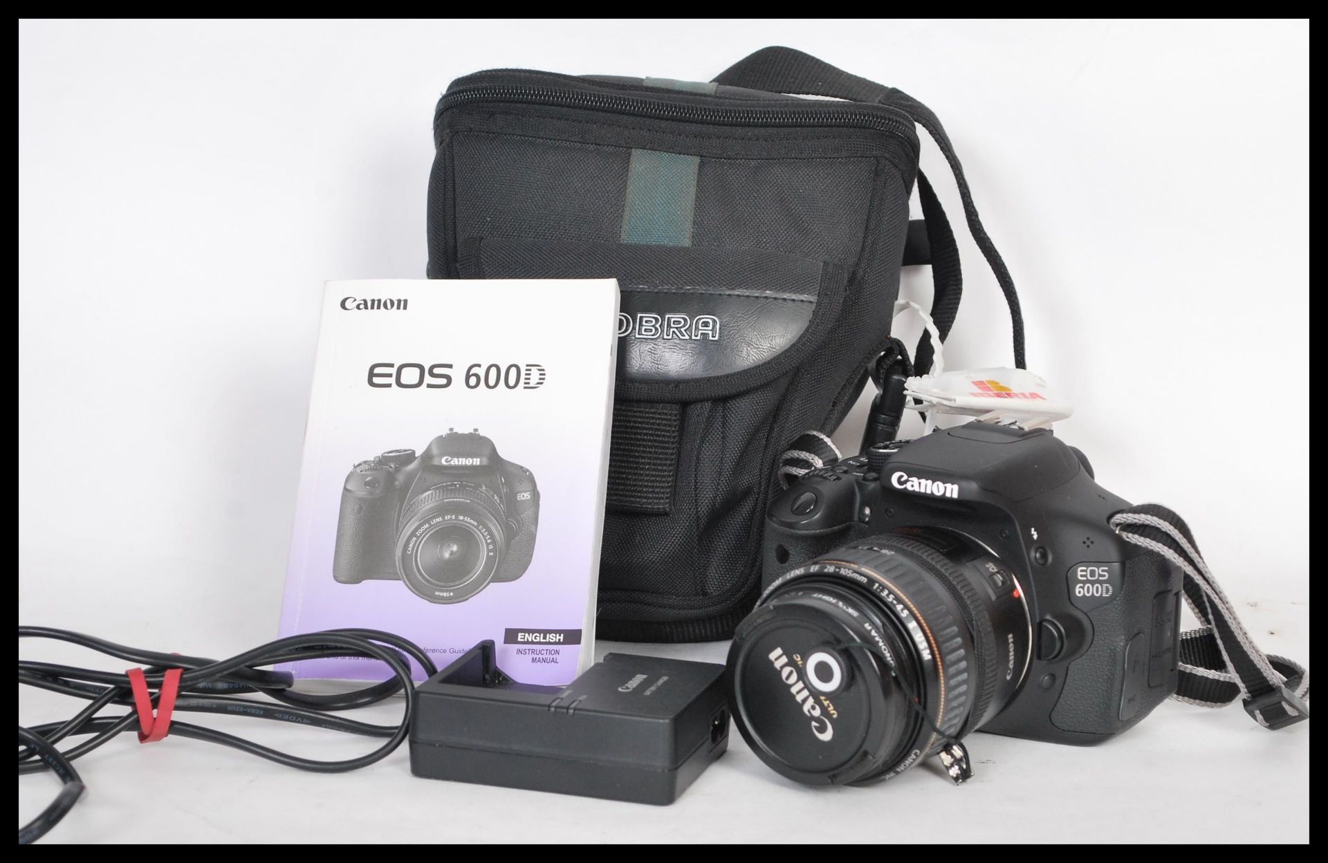 A Canon EOS 600D digital camera in working order, with carry case, charger, power lead, spare