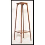 Roehampton Interest - A 20th Century rare mahogany two tier torchere / jardiniere plant stand raised