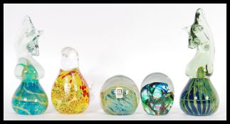 A group of five 20th Century Mdina studio art glass paperweights to include a pair of seahorse