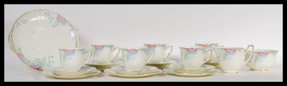 A 20th Century Royal Doulton tea service in the Nerissa pattern consisting of six cup saucer side