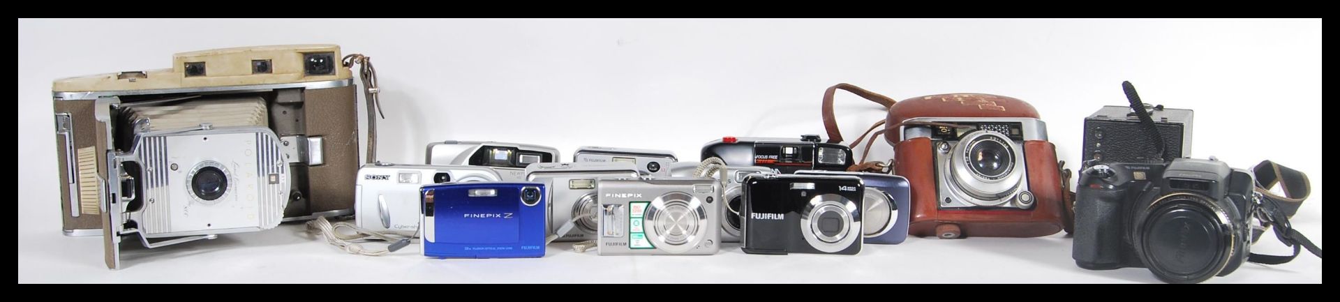 A collection of vintage and digital cameras to include a Polaroid 800 Land Camera, Kodak No2