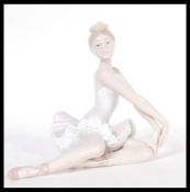 A Lladro ceramic figurine of a Ballerina entitled Ballet Graceful Pose model 06174 complete in