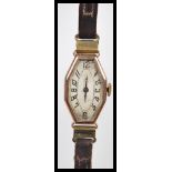 An early 20th Century Art Deco ladies wrist having a octagonal elongated face with Arabic numerals