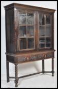 A good Victorian Jacobean commonwealth revival oak bookcase on stand. Raised on bobbin turned