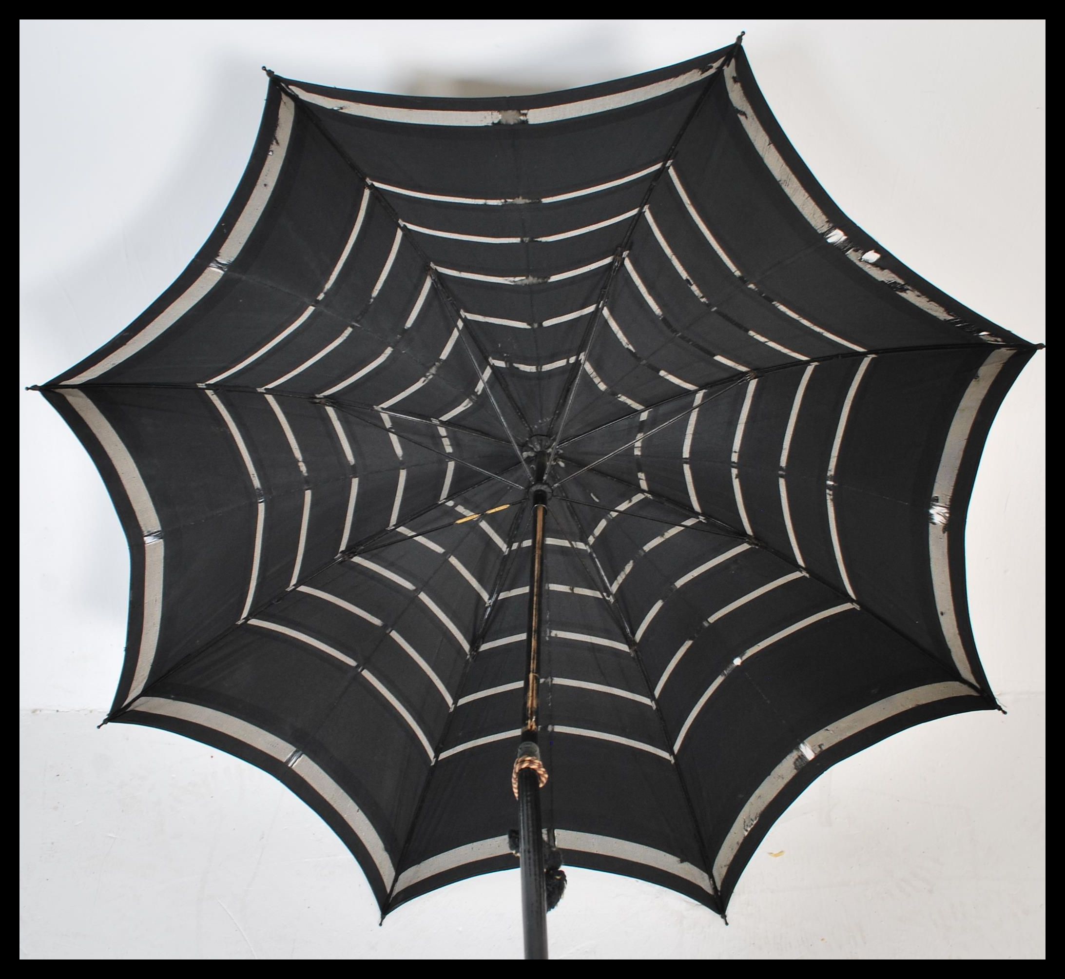 An early 20th Century Edwardian silk parasol with an ebonised carved handle the silk with - Image 2 of 6