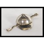 A continental silver 800 stamped miniature of equestrian interest in the form of a riding crop and