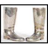 A pair of 20th century silver plated boot measures for spirits. Complete with the white inner