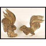 A pair of early 20th Century silver plated figurines depicting fighting cocks or cockerels. Both