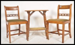 A pair of Regency 19th century golden oak bar back dining chairs with green velour seats and spindle