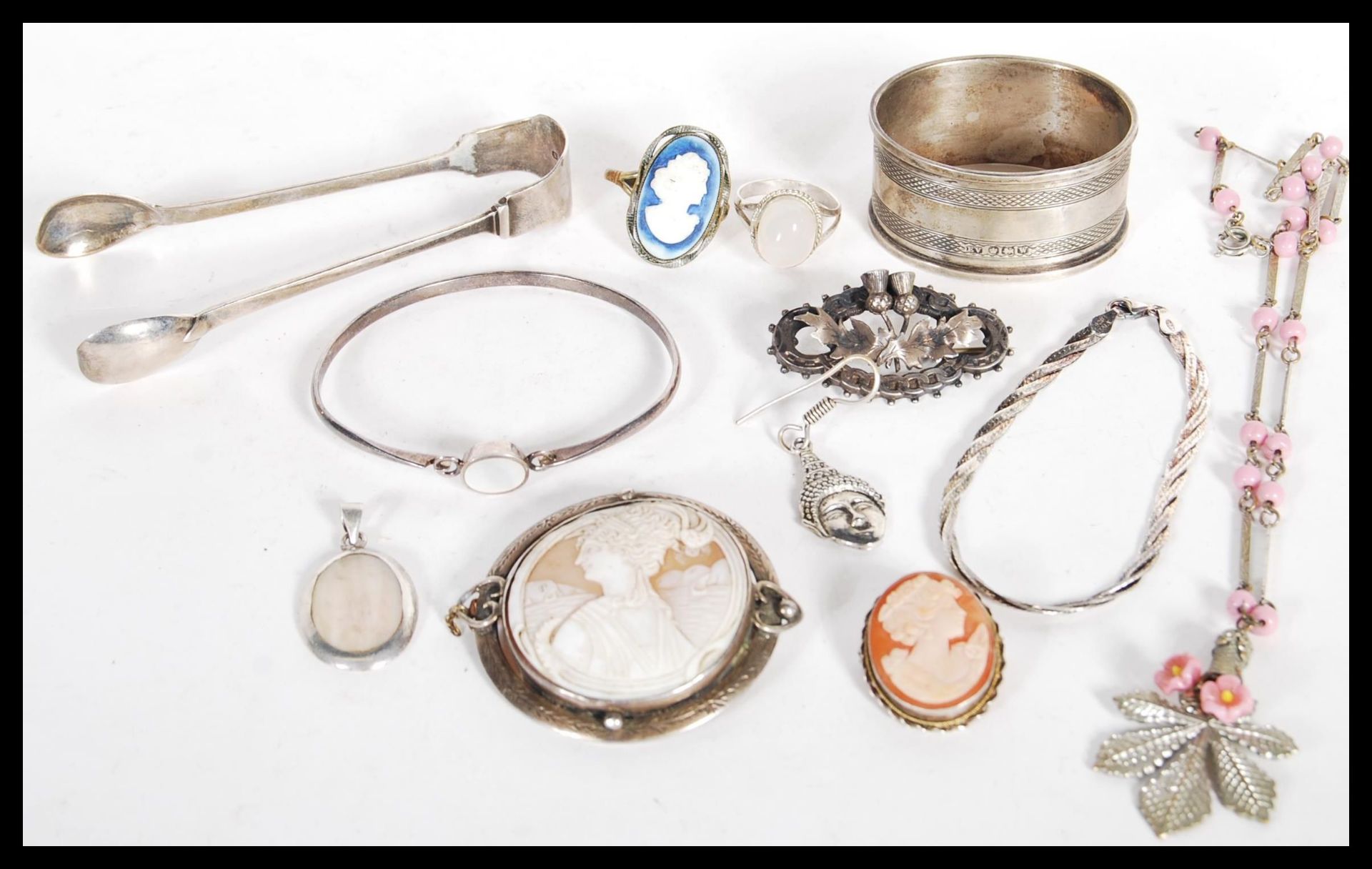 A group of hallmarked silver and sterling silver jewellery to include brooches, cameo, Scottish