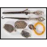 A 20th Century selection of silver and related items to include a steel button hook with a