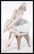A Lladro ceramic figurine of a Ballerina entitled Ballet Opening Night model 05498 complete in