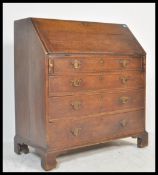 An 18th / 19th Century Georgian country oak  fall front bureau, fully appointed interior over four