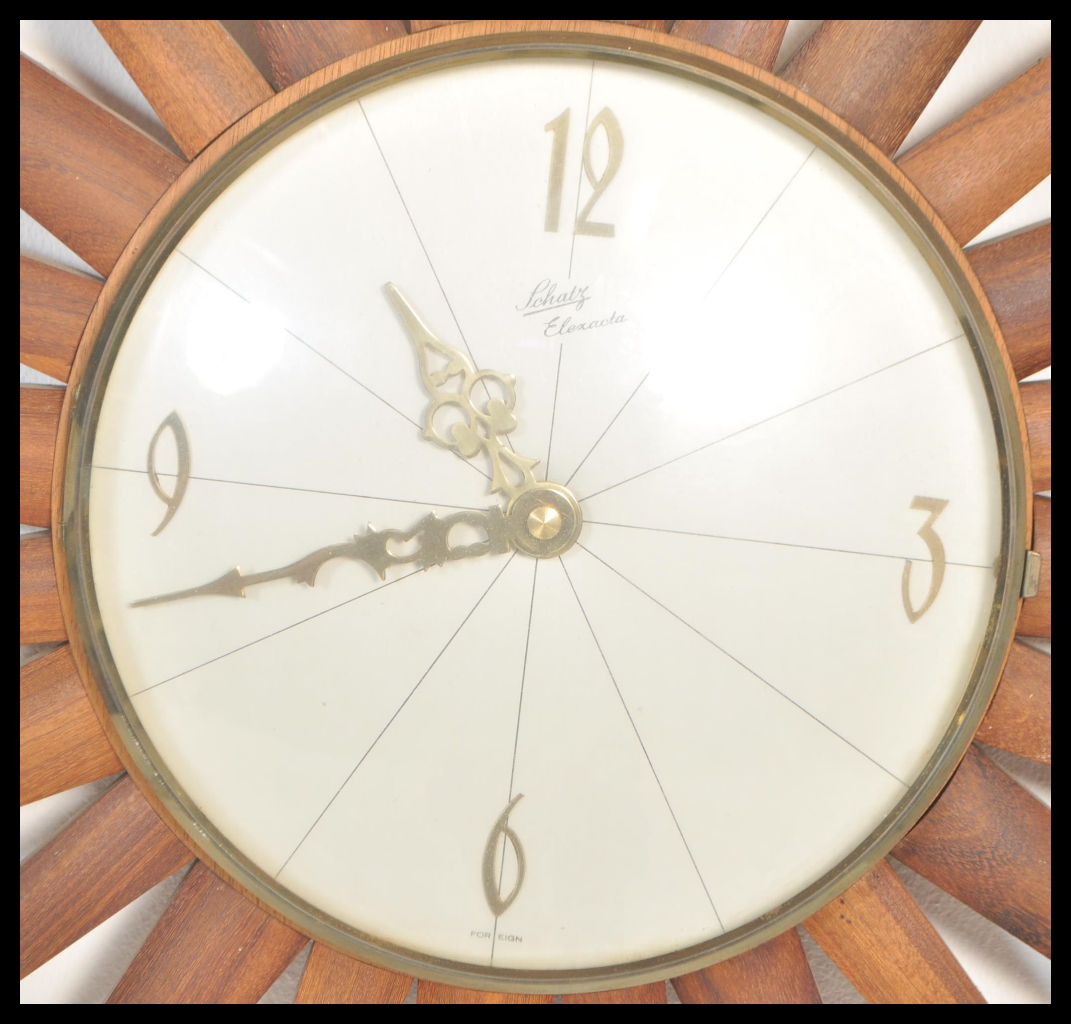 A retro 20th teak wood sunburst wall clock, the silvered clock face with baton numerals and marked - Image 2 of 3