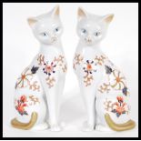 A pair of 20th Century collectable John Jenkins cats in the manner of Crown Derby. The cats modelled