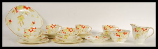 An unusual Royal Doulton Oban pattern tea service consisting of five cup saucer side plate trios,