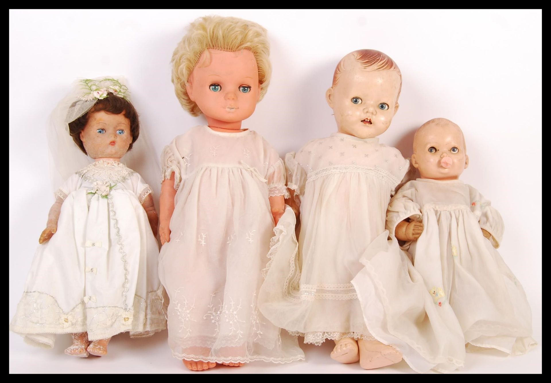 ASSORTED VINTAGE PLASTIC DOLLS IN WHITE DRESSES