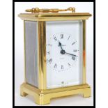 An early 20th Century French gilt brass cased carriage clock by Duverdrey Bloquel. The white