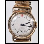 A vintage 20th Century 9ct gold longines gentleman's wrist watch having baton markers and arabic