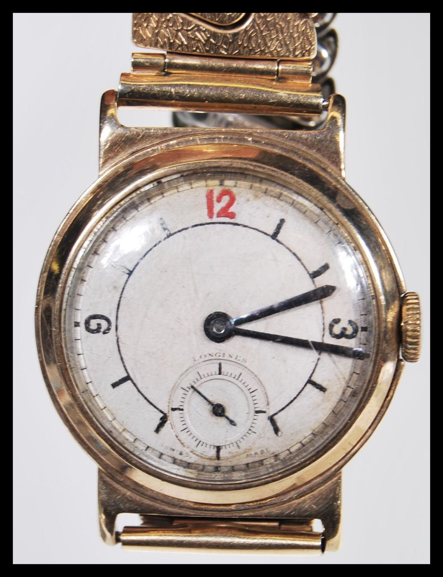 A vintage 20th Century 9ct gold longines gentleman's wrist watch having baton markers and arabic