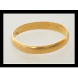 A hallmark 22ct gold wedding band ring. Hallmarked Birmingham 1921. Weight 2.3g. Size N.5.