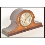 An early 20th Century Napoleon's hat / dome top mahogany mantel clock having box wood inlaid